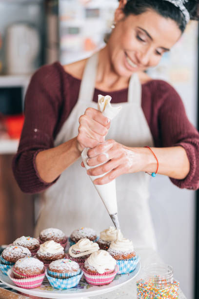 istock Confectioner decorating Chocolate Muffins 1193858416