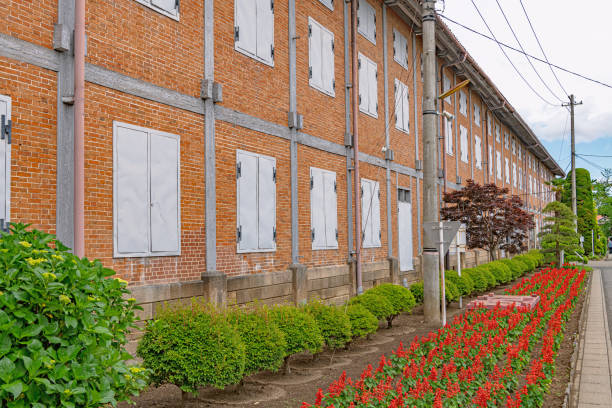 Tomioka, Gunma, Japan - May 29 2019 : East Cocoon Warehouse of the Tomioka Silk Mill. Tomioka Silk Mill is Japan's oldest modern model silk reeling factory, established in 1872.
