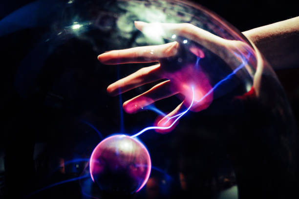 istock A plasma ball that is releasing electricity on the hand 1193859953