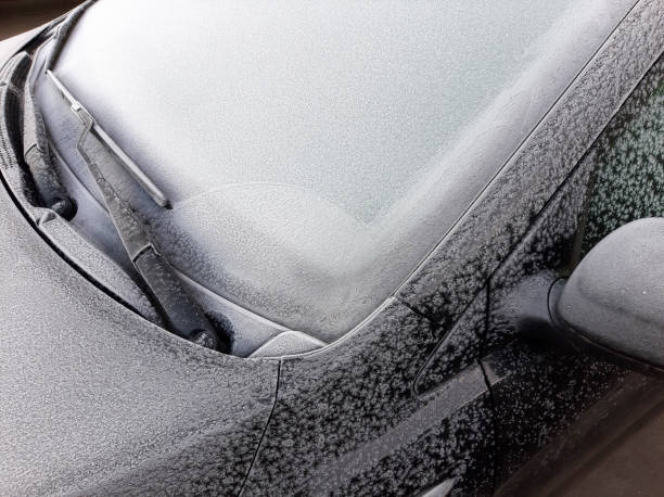 istock Snow covered car window with wipers, macro, close up 1193863038