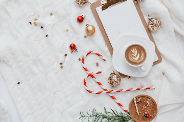 istock Hot coffee, Decorations and note board over white warm knitted sweater oversize, Christmas blogger background - cozy home still life, top view 1193863867