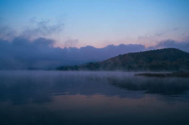 istock Sunset or sunrise over river and mountain 1193863950