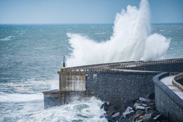 istock big waves are breaking furious at coastal shore 1193868825