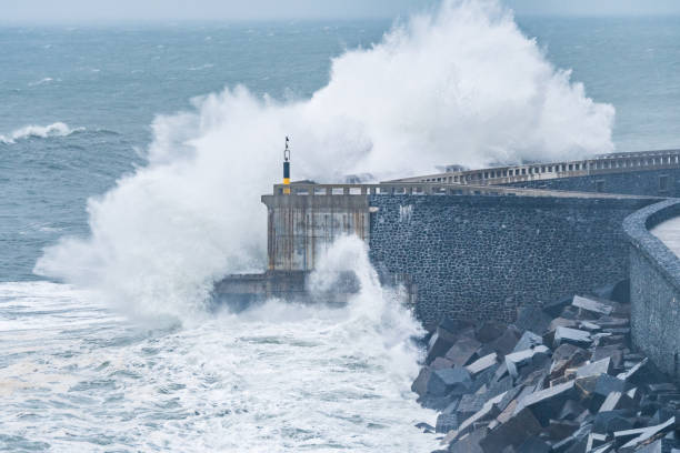 istock big waves are breaking furious at coastal shore 1193868856