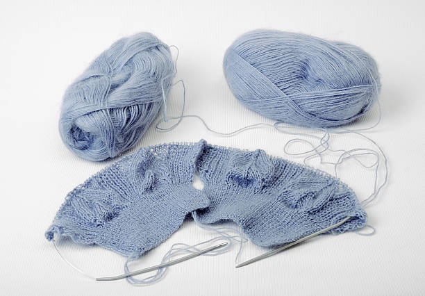 istock Knitted cloth with needles and clues 119386979