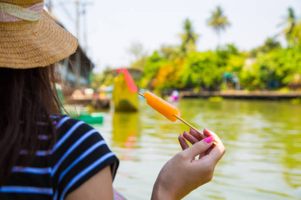 Thai woman eating ice cream