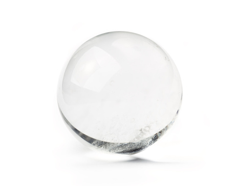 Natural quartz crystal ball - used for fortune telling. Isolated on white.