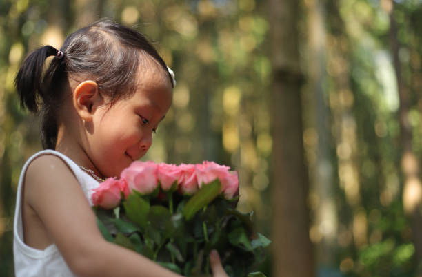 istock a Asian girl and rose. 1193872082