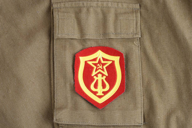 istock Soviet Army Military Orchestra Service shoulder patch on khaki uniform background 1193872099