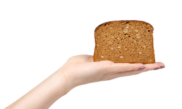 istock Brown bread with seeds, heathy food. Isolated on white. 1193875840