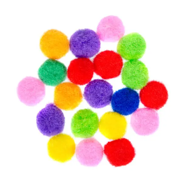 Colored pom pom, party and sewing decoration. Isolated on white background.
