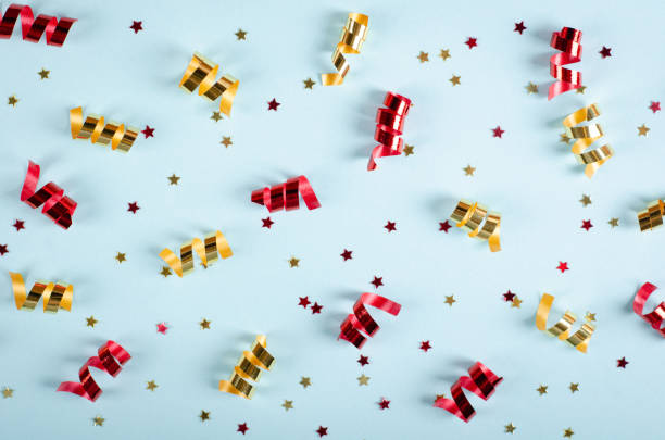 istock Colored confetti composition on blue background, party and celebration decoration. 1193876899