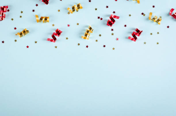istock Colored confetti composition on blue background, party and celebration decoration. 1193876904