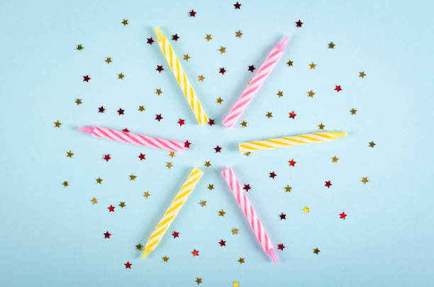 istock Colored candles composition on blue background, party and celebration decoration. 1193877046