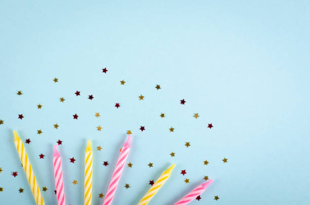 istock Colored candles composition on blue background, party and celebration decoration. 1193877051