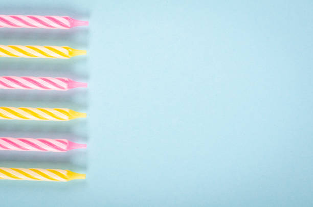 istock Colored candles composition on blue background, party and celebration decoration. 1193877090