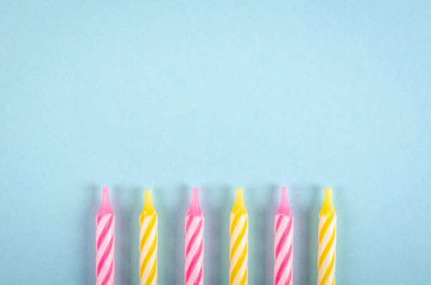 istock Colored candles composition on blue background, party and celebration decoration. 1193877101
