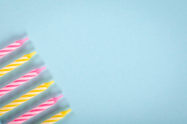 istock Colored candles composition on blue background, party and celebration decoration. 1193877110