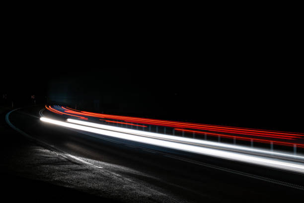istock lights of cars with night 1193877183