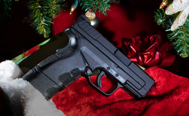 istock Handgun for a Christmas present 1193877925