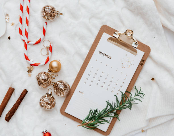 istock Christmas calendar background with decorations on white bed, top view, flat lay 1193878215