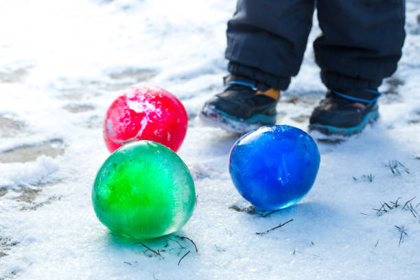 istock child plays with frozen balls 1193879931