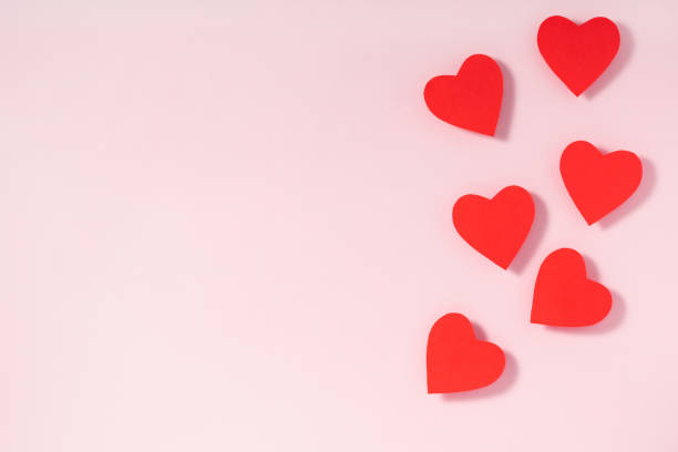 istock Valentine's day frame composition. Red hearts on pastel pink background. Top view, flat lay, copy space 1193893231