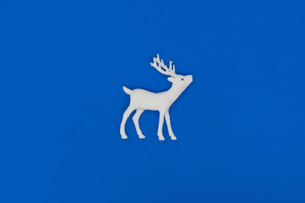 istock New Year and Christmas decorations. White deer. Top view, flat lay, copy space. 1193893371