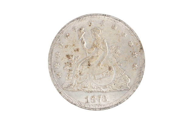 istock old vintage silver dollar isolated on background 1193894038