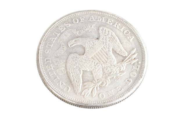 istock old vintage silver dollar isolated on background 1193894178