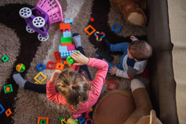 istock Babies playing with toys at home 1193894220