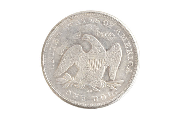 istock old vintage silver dollar isolated on background 1193894240