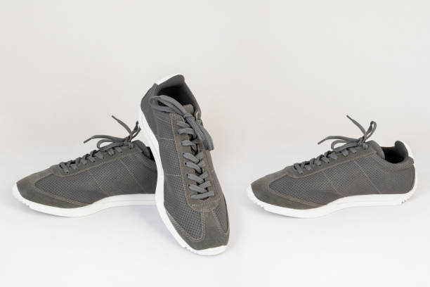 istock gray sneakers shoes isolated on white background side and front view 1193894495