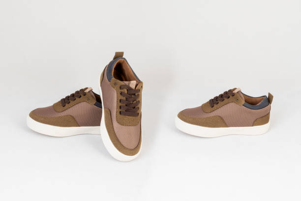 istock brown sneakers shoes isolated on white background side and front view 1193897692