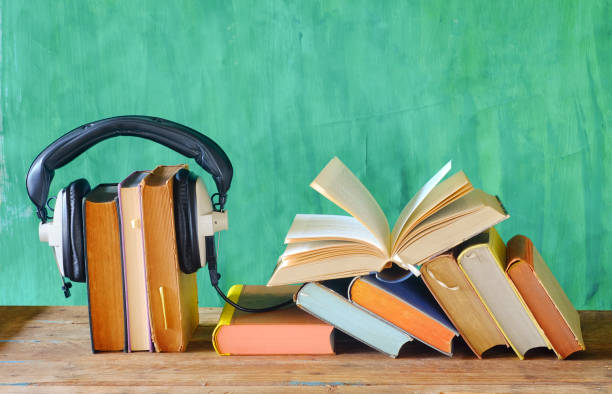 istock audio book concept with open book and headphones,  good copy space 1193897920