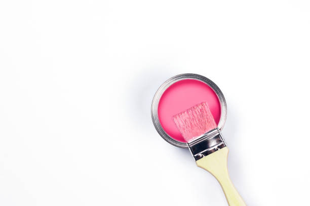 istock White background with pink paint jar and brush. 1193899167