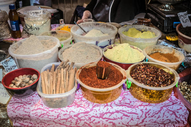 Georgian street market place in Kutaisi, vendors selling local products, delicious food and spices. One of the most famous Georgian traditional sweets and desert churchkhela. Churchkhela is a traditional Georgian cuisine candle-shaped candy. The main ingredients are grape must, nuts, and flour, almonds, walnuts, hazelnuts, and chocolate.