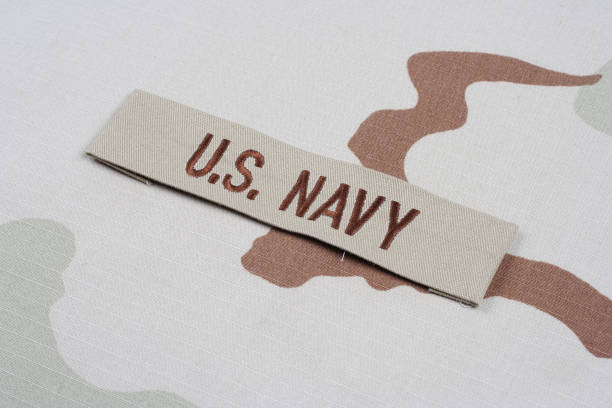 istock US NAVY branch tape on desert camouflage uniform 1193903508