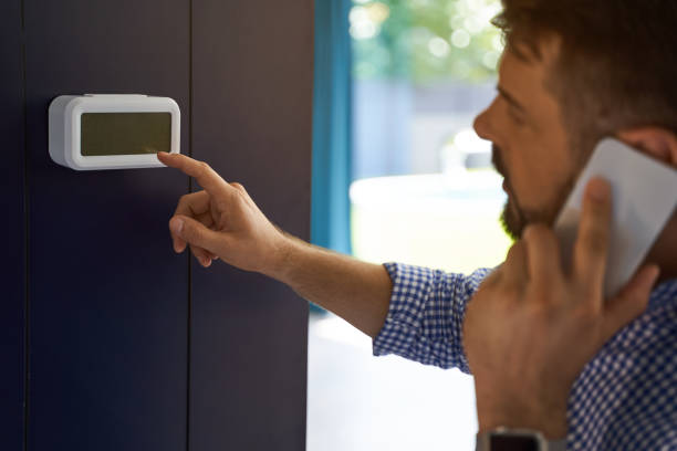 istock Close up of man looking on control panel in the house 1193904161