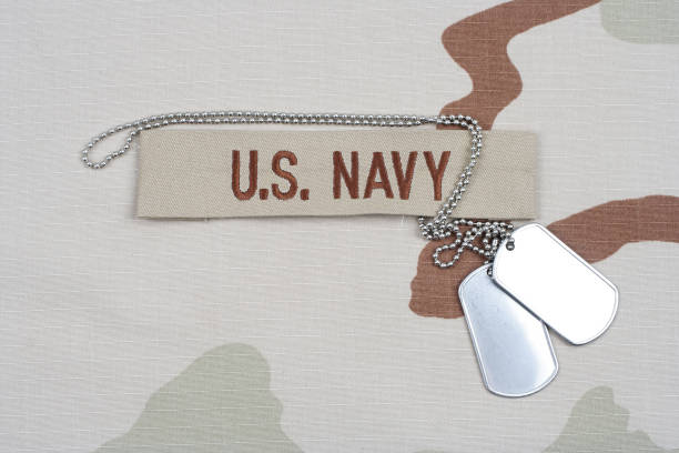 istock US NAVY branch tape with dog tags on desert camouflage uniform 1193904245