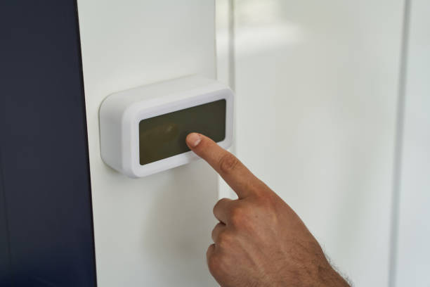 istock Close up of male hand using security system indoors 1193904267
