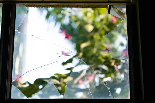 Photo of Looking through broken glass window