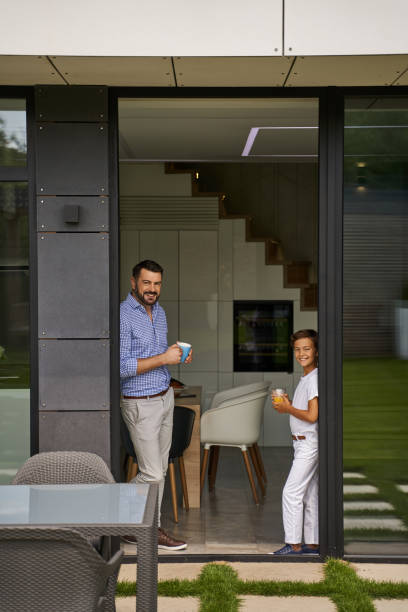 istock Smiling father and son looking at camera 1193906885
