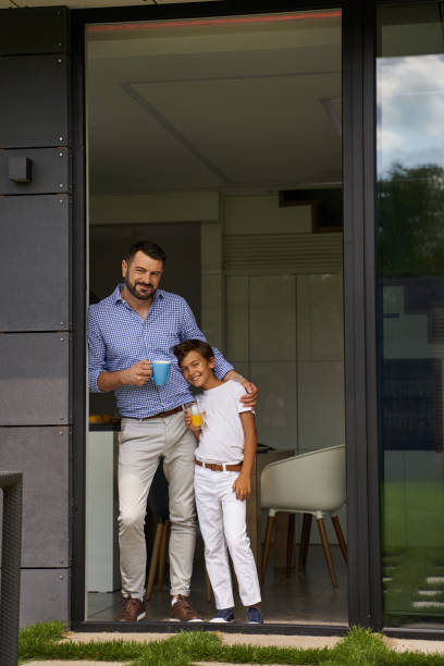 istock Happy dad and son resting in his home 1193907358