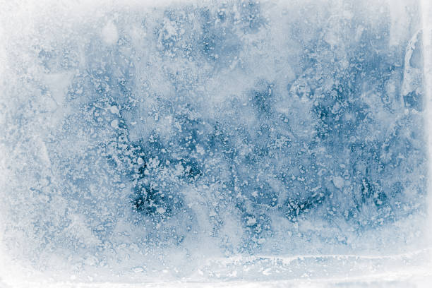 istock Textured, blue toned, ice block surface with hoar frost, background. 1193907878