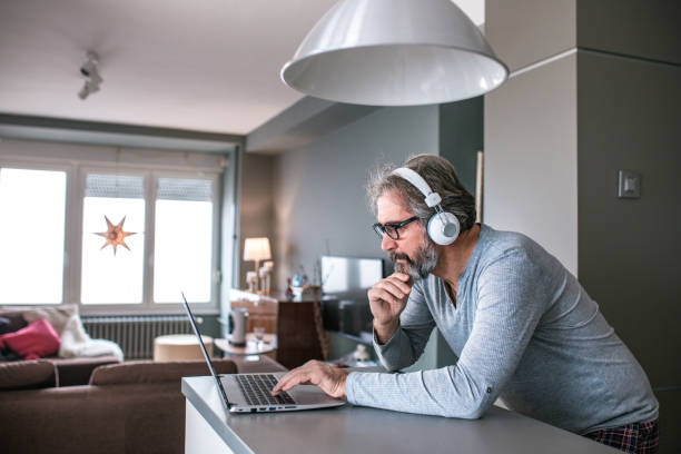 istock Senior man working from home 1193910239