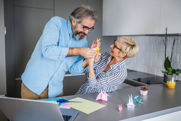 Senior Making Things 60+ Senior Making Origami Stock Photos, Pictures & Royalty-Free Images ...
