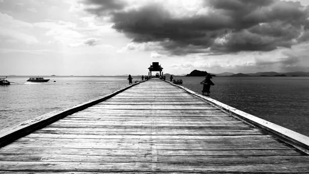 istock Pier coming out of rocks 1193910467
