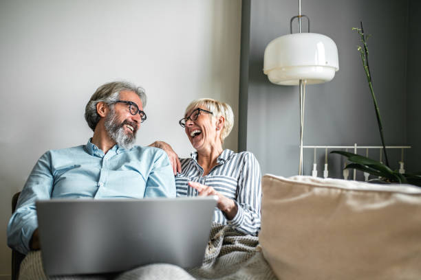 istock Seniors using laptop at home 1193910499