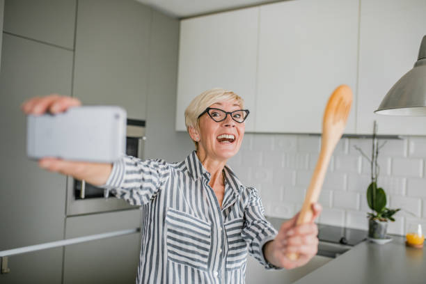 istock Senior woman vlogging 1193910533